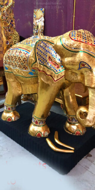 wooden elephant worship Phra Phrom at Erawan Shrine BKK. (praprom)